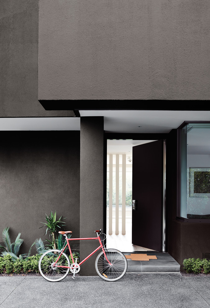 This is an example of a mid-sized contemporary two-storey grey exterior in Melbourne.