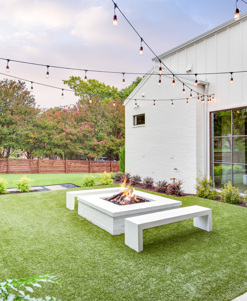 Country full sun garden in Dallas with a fire feature.