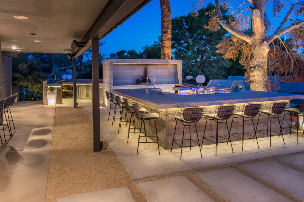 Huge transitional backyard concrete patio kitchen photo in Phoenix with no cover