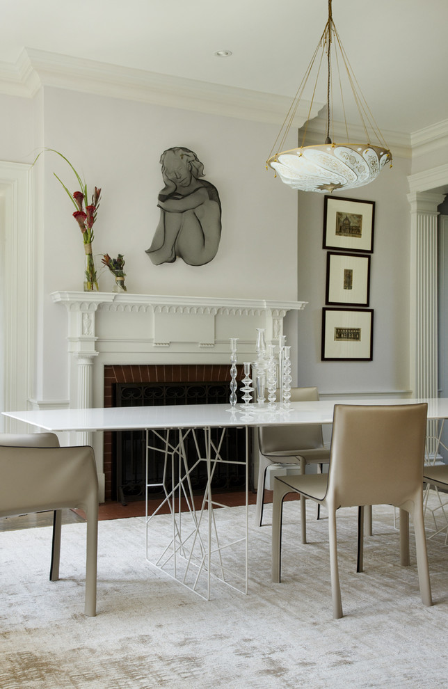 Inspiration for a contemporary dining room in Boston with white walls and a standard fireplace.