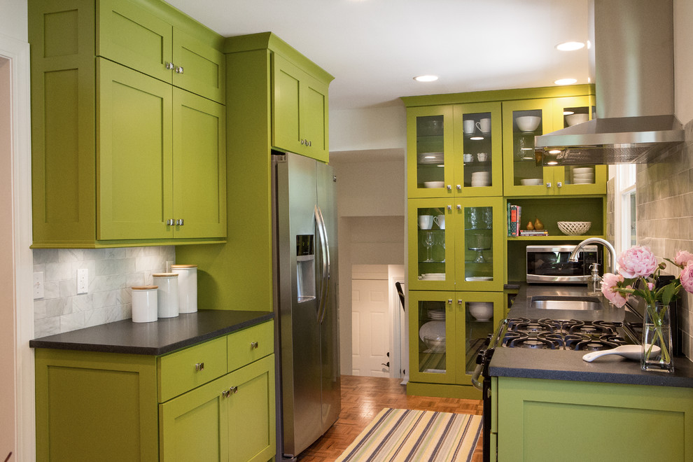 Design ideas for a small midcentury galley eat-in kitchen in Grand Rapids with an undermount sink, shaker cabinets, green cabinets, laminate benchtops, white splashback, stone tile splashback, stainless steel appliances, medium hardwood floors and no island.