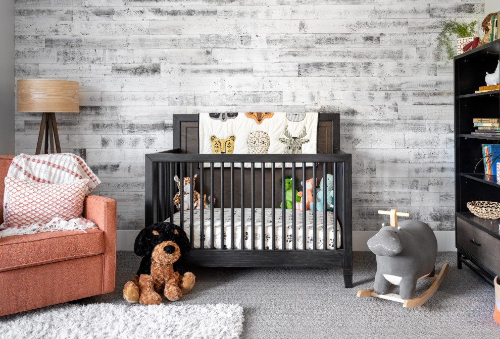 Photo of a mid-sized contemporary gender-neutral nursery in Portland with carpet, grey floor and multi-coloured walls.