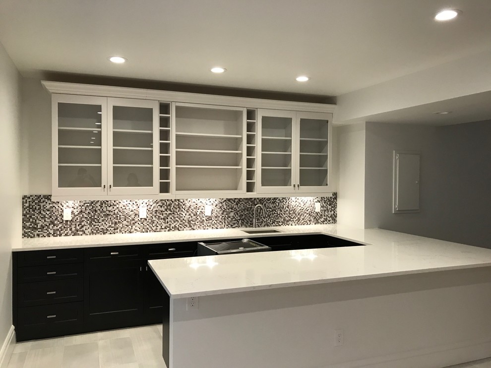 Inspiration for a mid-sized traditional u-shaped wet bar in Denver with an undermount sink, glass-front cabinets, white cabinets, quartz benchtops, grey splashback, metal splashback, porcelain floors and white floor.