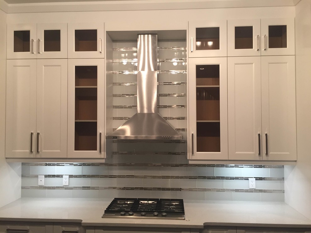 Example of a transitional kitchen design in Calgary