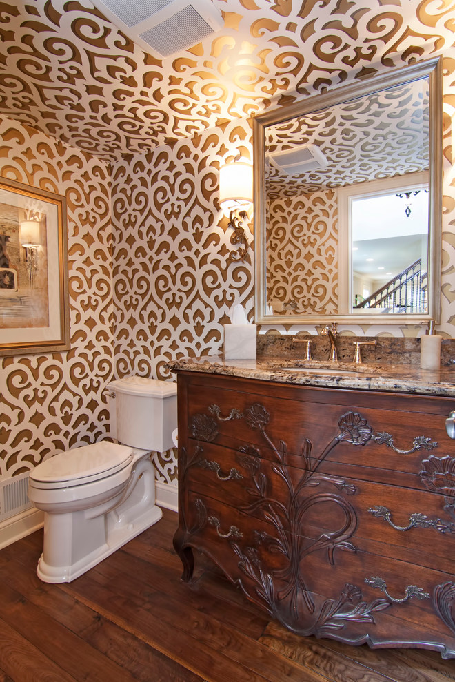 This is an example of a traditional powder room in Minneapolis with granite benchtops.