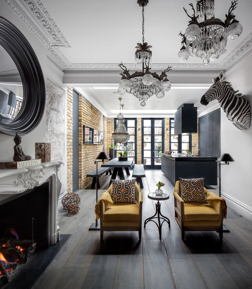 Photo of a medium sized eclectic open plan living room in London with grey walls, dark hardwood flooring, a two-sided fireplace, a stone fireplace surround and no tv.