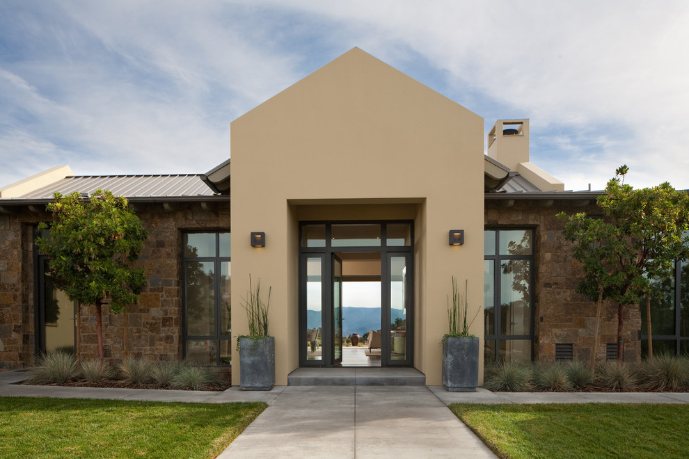 Photo of a contemporary exterior in Santa Barbara with stone veneer.