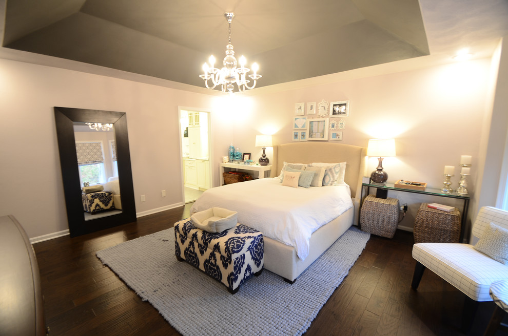 Inspiration for a mid-sized transitional master bedroom in Chicago with grey walls and dark hardwood floors.