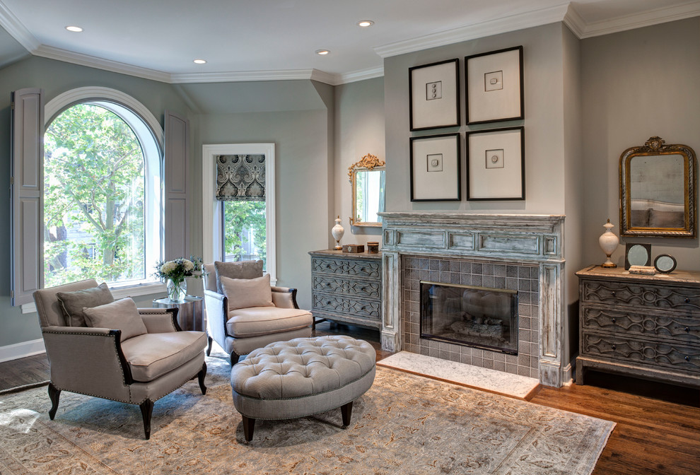 This is an example of a large traditional formal living room in Chicago with grey walls, dark hardwood floors, a standard fireplace and a tile fireplace surround.