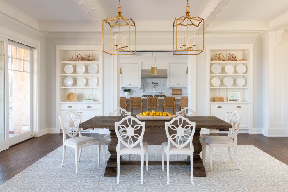Inspiration for a large transitional kitchen/dining combo in Boston with grey walls, medium hardwood floors, brown floor, coffered and decorative wall panelling.