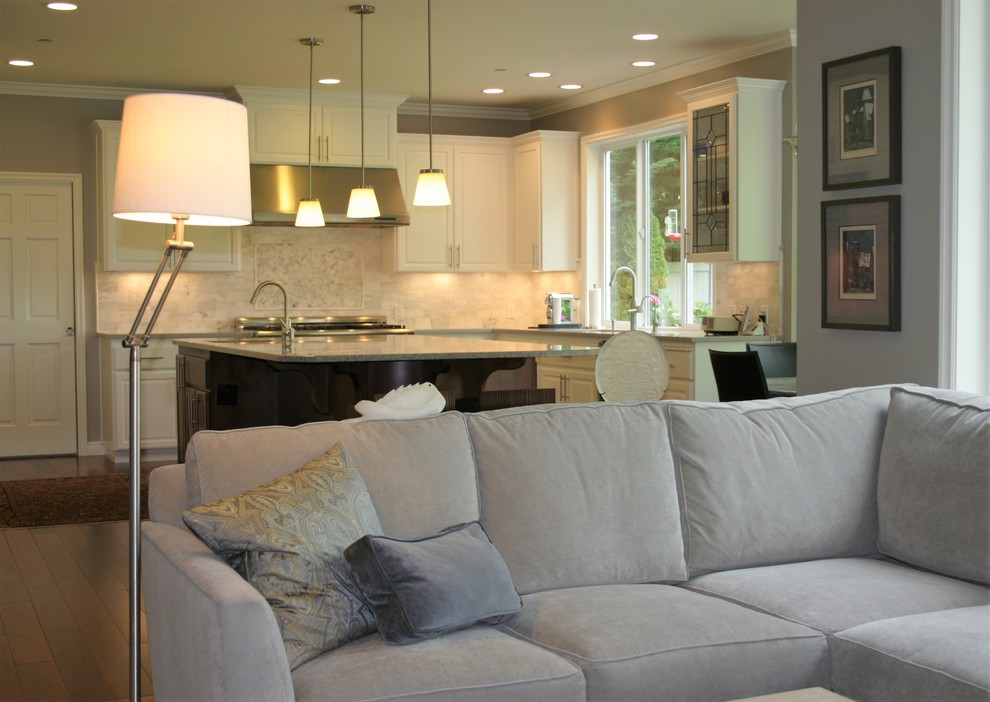 Eat-in kitchen - large transitional u-shaped dark wood floor and brown floor eat-in kitchen idea in Austin with an undermount sink, raised-panel cabinets, white cabinets, granite countertops, white backsplash, marble backsplash, stainless steel appliances and an island