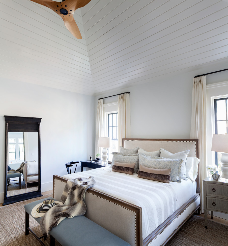 Beach style master bedroom in San Francisco with white walls.
