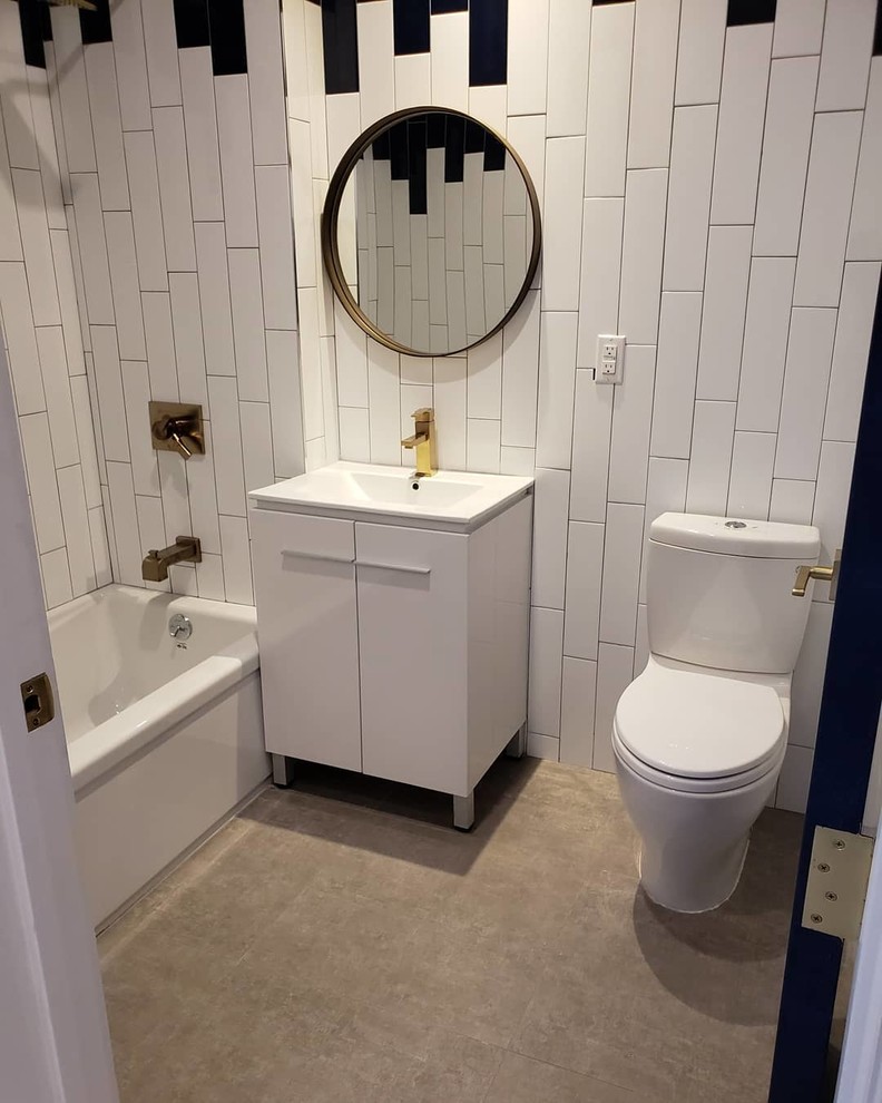 Design ideas for a mid-sized contemporary master bathroom in New York with beaded inset cabinets, white cabinets, a drop-in tub, a shower/bathtub combo, a two-piece toilet, black and white tile, ceramic tile, multi-coloured walls, cement tiles, an integrated sink, engineered quartz benchtops, beige floor, an open shower and white benchtops.