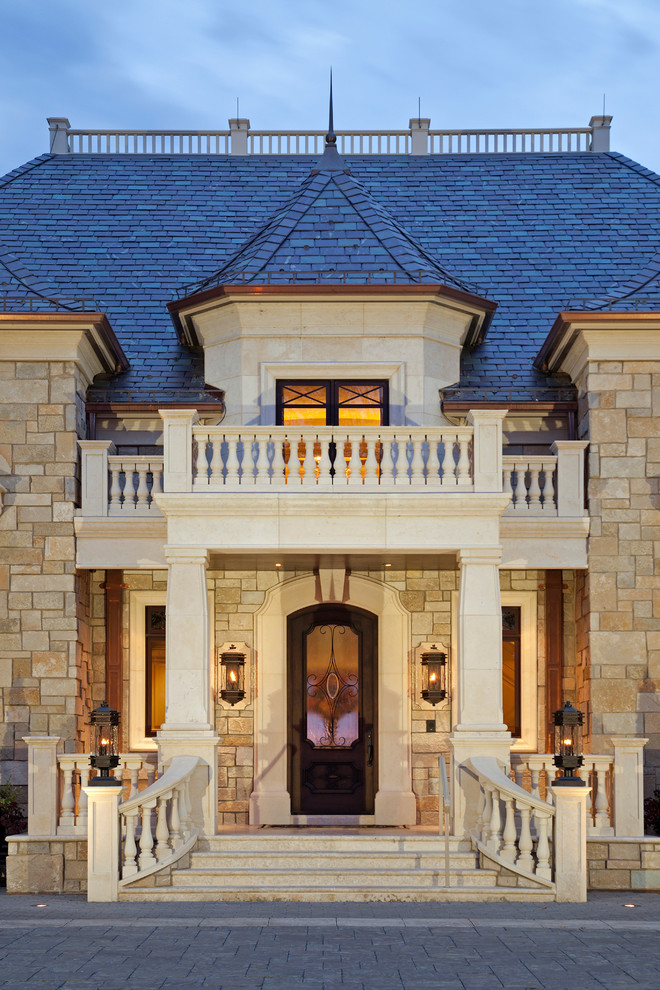This is an example of a traditional exterior in Minneapolis with stone veneer.