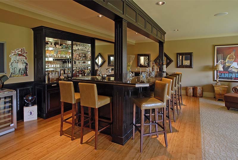 Photo of an expansive galley seated home bar in Seattle.