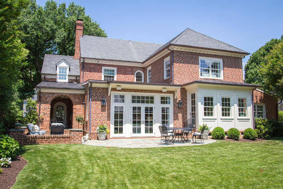 Design ideas for a large transitional two-storey brick red exterior in Richmond.