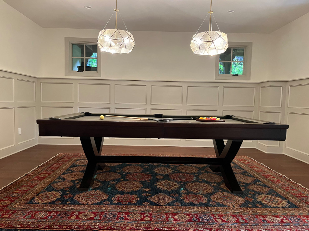 Design ideas for a large traditional games room in Other with white walls, medium hardwood flooring, a built-in media unit and panelled walls.