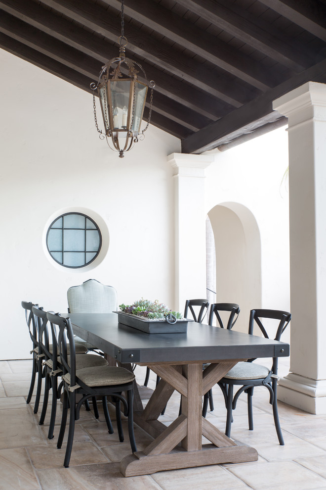 Inspiration for a transitional dining room in Los Angeles with white walls, no fireplace and beige floor.