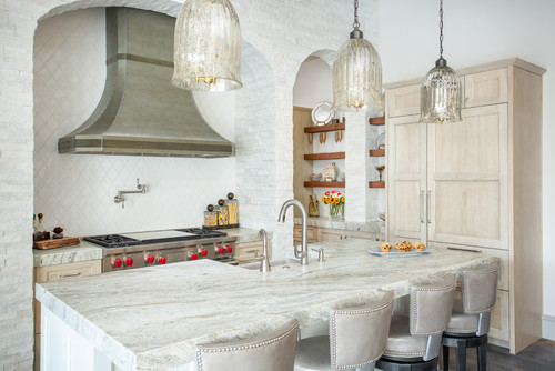 Kitchen suppliers highlight a Mediterranean kitchen with warm wood cabinets and a butler pantry look