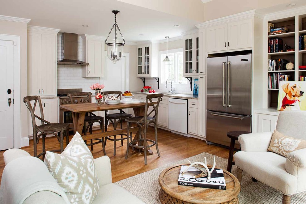 Inspiration for a small eclectic l-shaped separate kitchen in Atlanta with an undermount sink, shaker cabinets, white cabinets, granite benchtops, white splashback, subway tile splashback, stainless steel appliances and light hardwood floors.