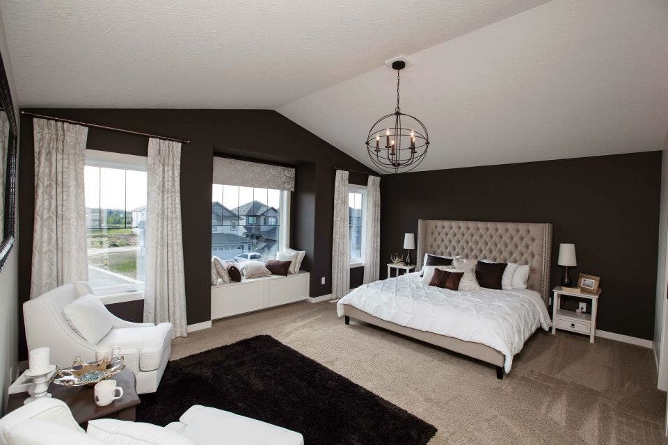 Design ideas for a large transitional master bedroom in Edmonton with brown walls, carpet and no fireplace.