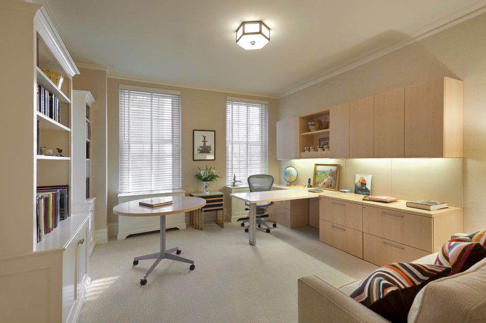 Mid-sized transitional study room in New York with beige walls, carpet, no fireplace and a built-in desk.