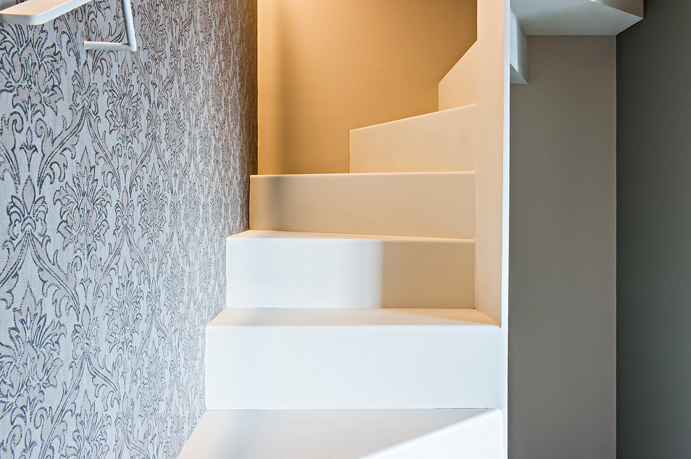 This is an example of a small contemporary metal spiral staircase in Turin with metal risers.