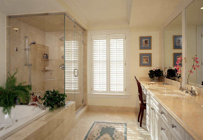Inspiration for a large traditional master bathroom in Boston with beaded inset cabinets, white cabinets, a drop-in tub, a double shower, beige tile, marble, beige walls, marble floors, an undermount sink, marble benchtops, beige floor and a hinged shower door.