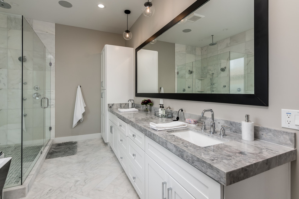 Inspiration for a transitional master bathroom in Phoenix with shaker cabinets, white cabinets, beige walls, an undermount sink, white floor, a hinged shower door and grey benchtops.