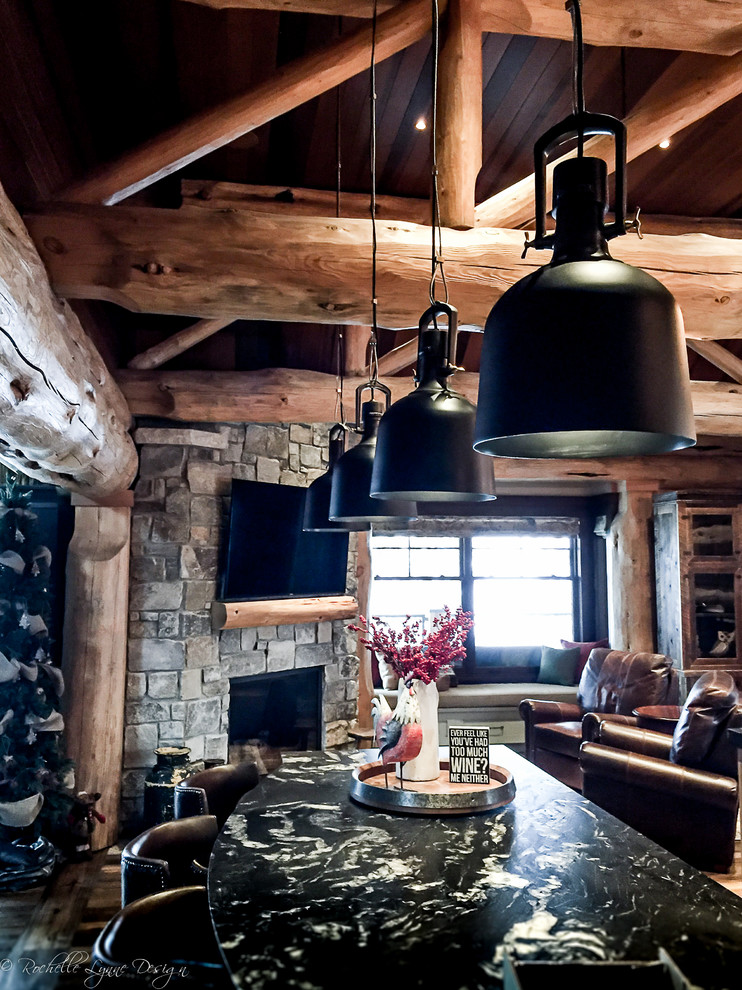 Mountain style l-shaped medium tone wood floor open concept kitchen photo in Calgary with shaker cabinets, distressed cabinets, granite countertops and two islands