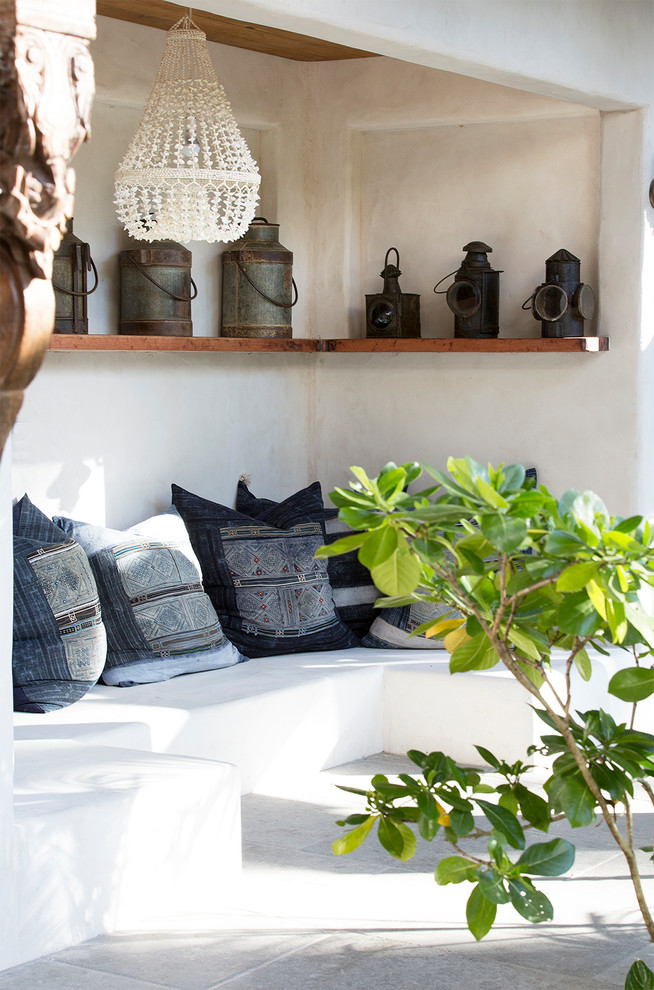Inspiration for a tropical patio in Cairns with a roof extension.