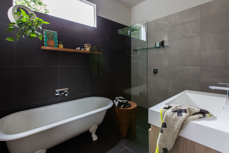 Photo of a mid-sized transitional master bathroom in Melbourne with flat-panel cabinets, light wood cabinets, a drop-in tub, a corner shower, a two-piece toilet, white tile, ceramic tile, grey walls, ceramic floors, a drop-in sink, engineered quartz benchtops, brown floor, an open shower and white benchtops.