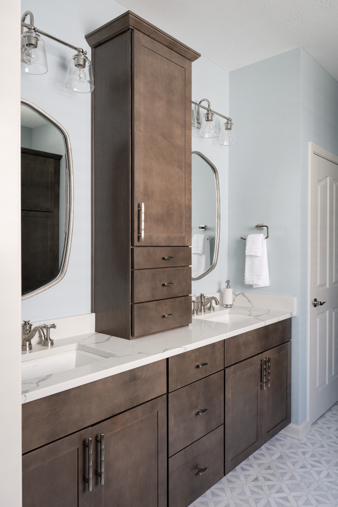 Photo of a medium sized modern ensuite bathroom in Indianapolis with shaker cabinets, black cabinets, a corner bath, a shower/bath combination, a one-piece toilet, white tiles, white walls, mosaic tile flooring, a vessel sink, marble worktops, white floors, a hinged door, white worktops, a single sink and a built in vanity unit.