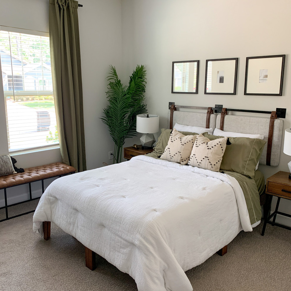 Design ideas for a medium sized urban guest bedroom in Charlotte with white walls, carpet and beige floors.