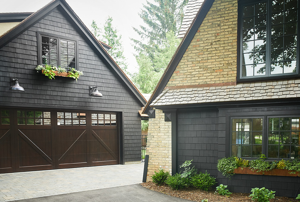 Photo of a transitional attached two-car garage in Grand Rapids.