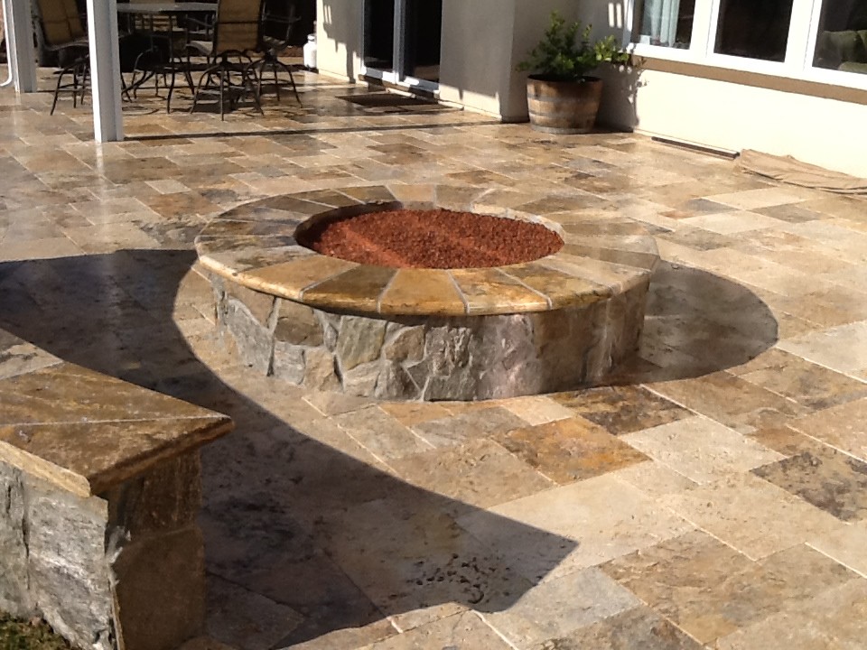 Patio - mid-sized traditional backyard stone patio idea in San Francisco with a fire pit and an awning