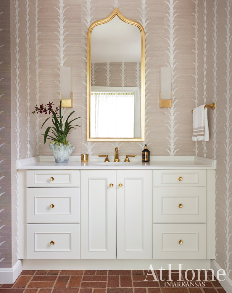 Inspiration for a transitional powder room in Little Rock with white cabinets, brick floors and white benchtops.