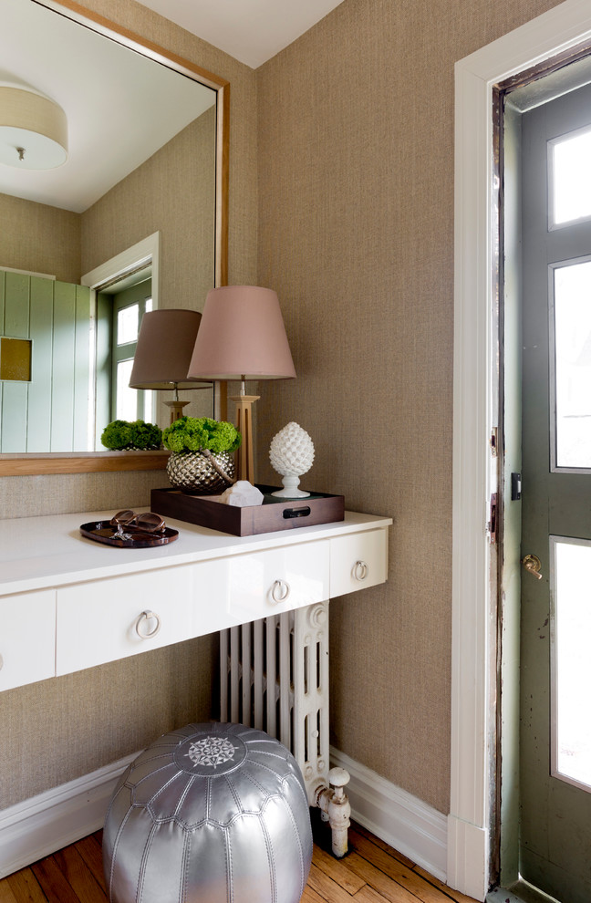 Inspiration for a small transitional vestibule in New York with beige walls, medium hardwood floors, a single front door and a green front door.
