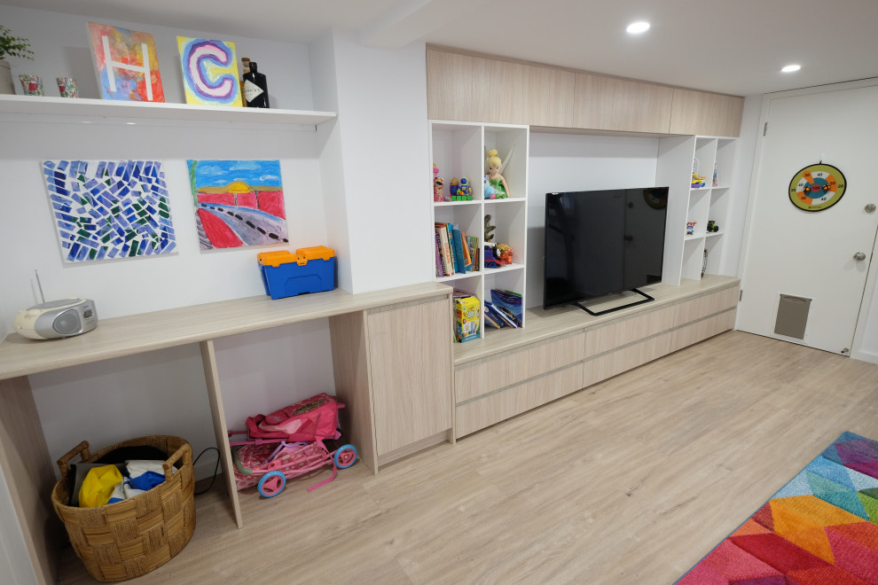 Design ideas for a large contemporary kids' playroom for kids 4-10 years old in Sydney with white walls and vinyl floors.