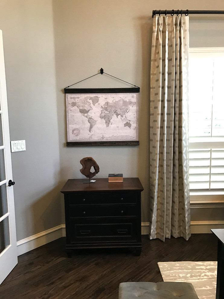 This is an example of a small transitional study room in Dallas with grey walls, dark hardwood floors, a freestanding desk and brown floor.