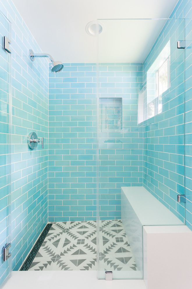 Inspiration for a mid-sized bathroom in Los Angeles with shaker cabinets, white cabinets, blue tile, ceramic tile, white walls, cement tiles, a drop-in sink, engineered quartz benchtops, grey floor and a hinged shower door.