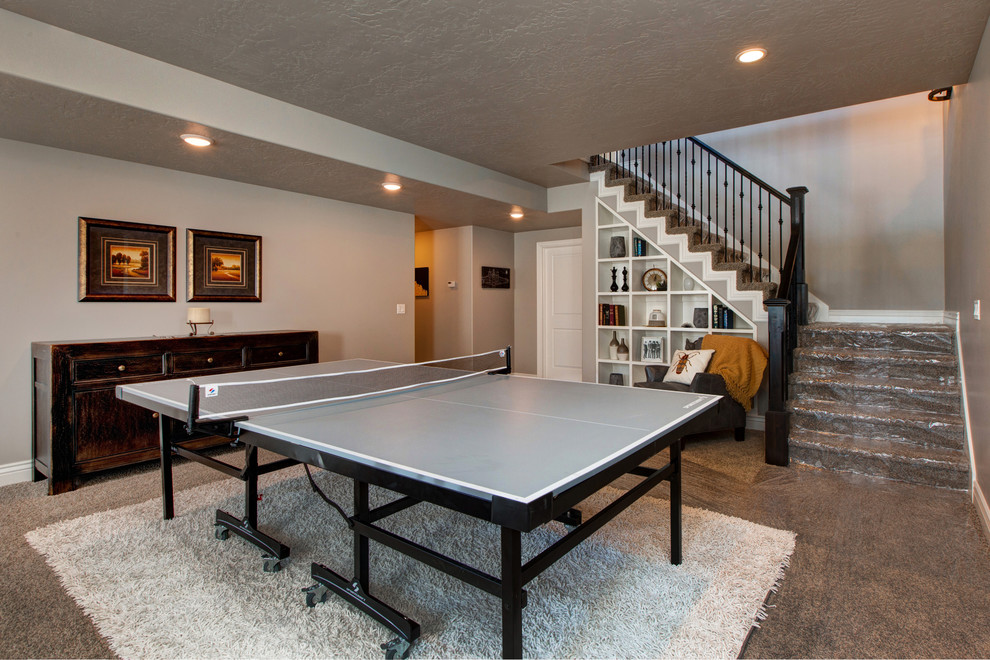 Inspiration for a large arts and crafts open concept family room in Salt Lake City with a game room, grey walls, carpet, no fireplace and brown floor.