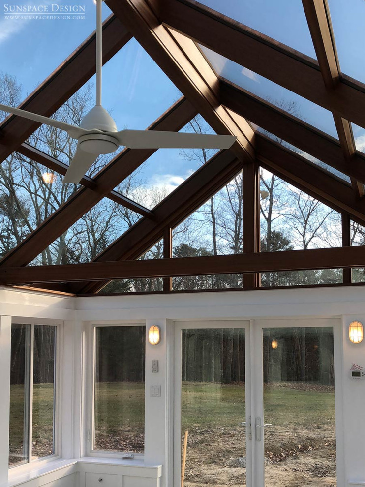 Design ideas for a mid-sized contemporary sunroom in Portland Maine with concrete floors, a glass ceiling and grey floor.