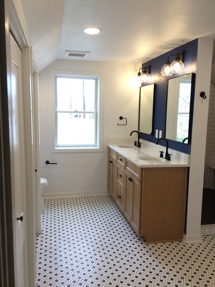 This is an example of a medium sized traditional ensuite bathroom in Denver with recessed-panel cabinets, light wood cabinets, a two-piece toilet, metro tiles, white walls, mosaic tile flooring, a submerged sink, engineered stone worktops, white floors, a hinged door, white worktops, a laundry area, double sinks and a freestanding vanity unit.