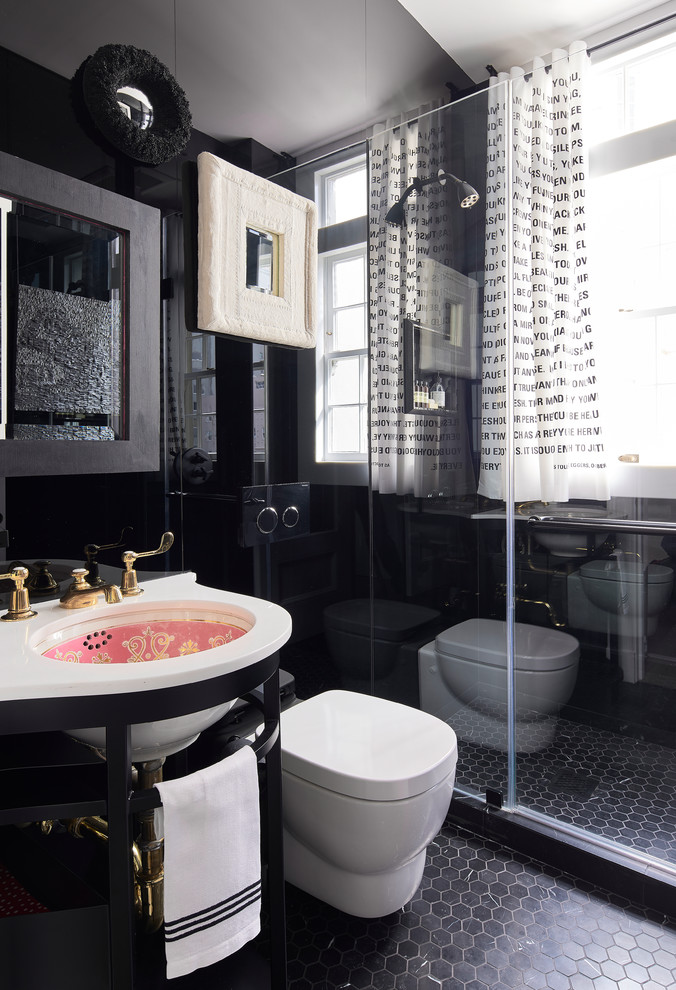 This is an example of a mid-sized eclectic 3/4 bathroom in San Francisco with an alcove shower, a one-piece toilet, black tile, an undermount sink, black floor, a hinged shower door, white benchtops, black walls and marble floors.