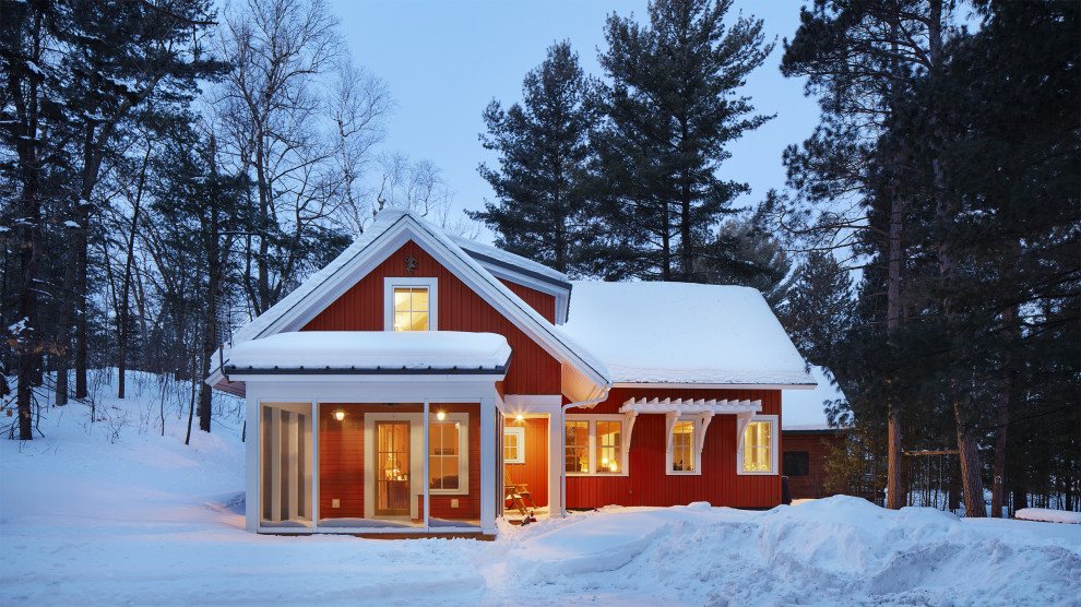 Mountain style red two-story board and batten exterior home photo in Minneapolis