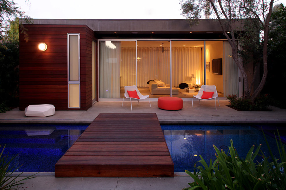 This is an example of a modern rectangular pool in Los Angeles with concrete slab.