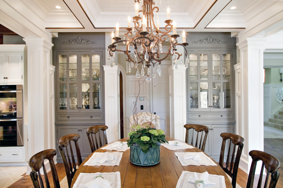 This is an example of a traditional dining room in Charleston with medium hardwood floors.