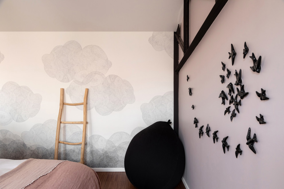 Large trendy master dark wood floor, exposed beam and wallpaper bedroom photo in Paris with pink walls