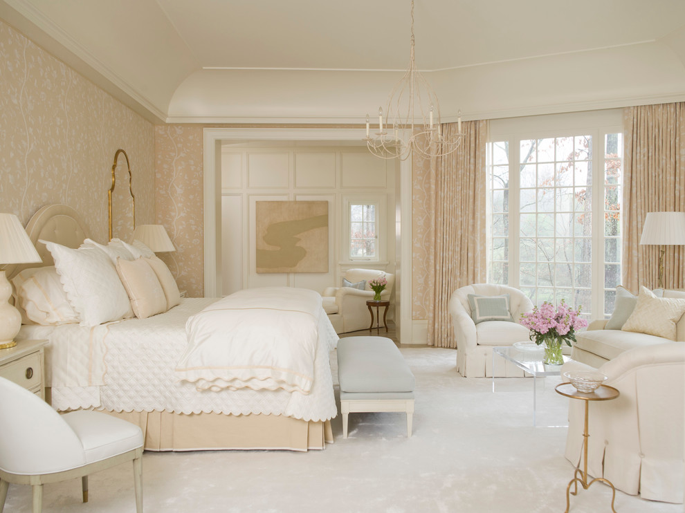 Inspiration for a traditional master bedroom in Charlotte with carpet and beige walls.